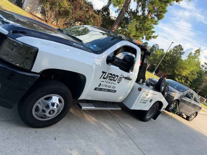 Turbo Tows truck parked, ready to assist with towing services in Houston.