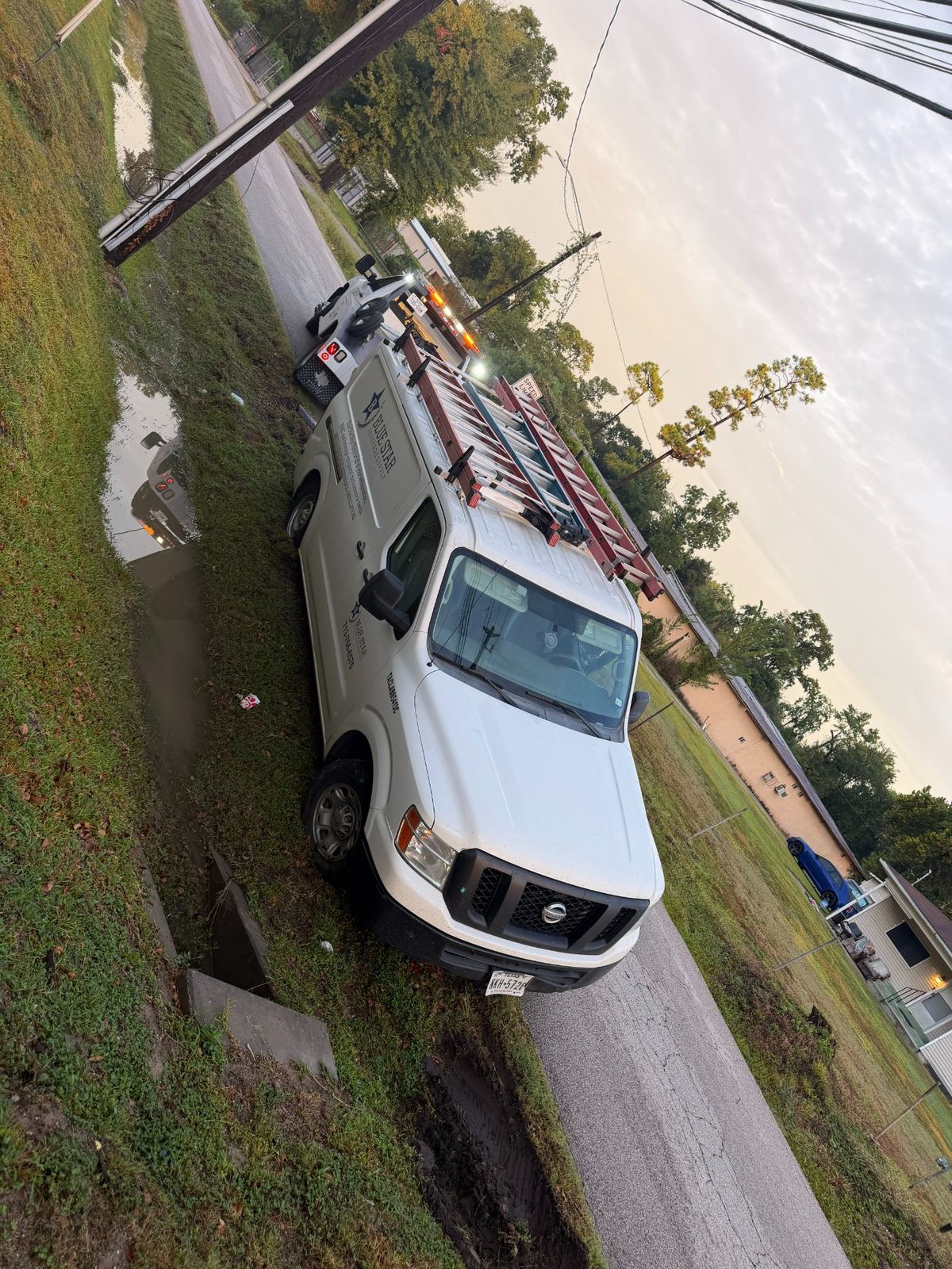 Turbo Tows vehicle parked on the roadside doing a winch out service in Houston, showcasing emergency towing and winch out equipment.